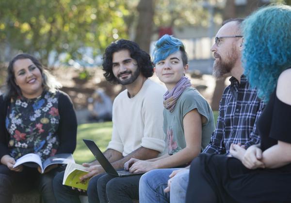 Degree in Journalism students having an outdoor workshop