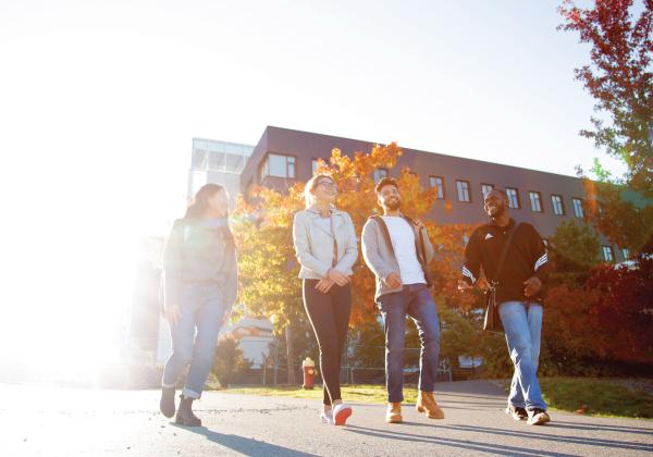 Young people walking in the sunshine.